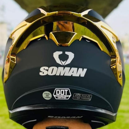 Full face Soman helmet in matte black with unique gold wing design for riders