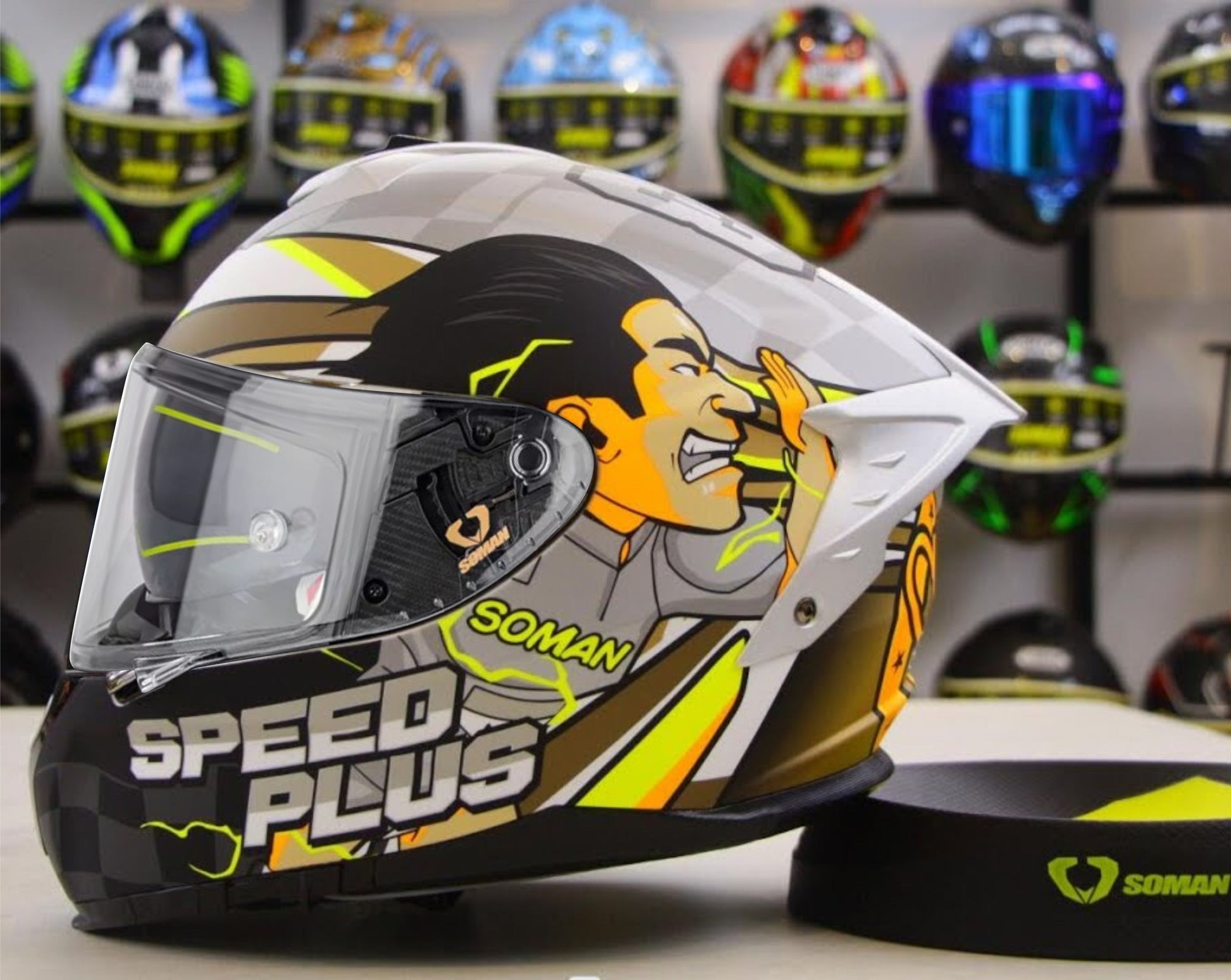 Soman Speed Plus full face motorcycle helmet in grey featuring bold manga-style designs, offering full protection with artistic flair.